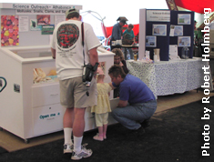 At the Science Outreach Booth. Photo by Robert Holmberg.